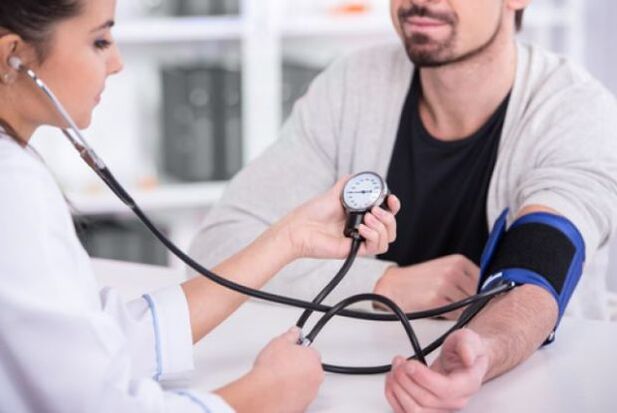 The doctor measures blood pressure in high blood pressure